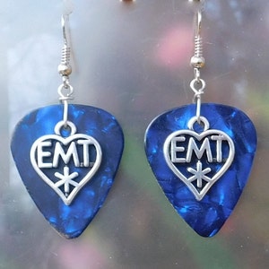 May include: A pair of blue guitar pick earrings with a silver heart charm that says "EMT" with a star inside the heart.