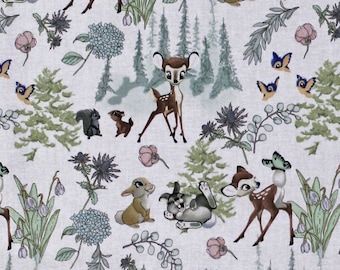 May include: White fabric with a repeating pattern of Bambi, Thumper, and other woodland creatures. The pattern includes butterflies, flowers, and trees. The fabric is measured with a ruler in inches.