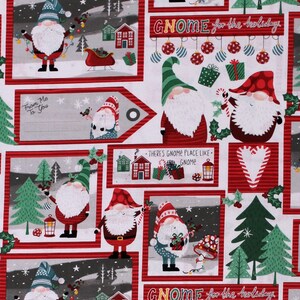 May include: White fabric with a repeating pattern of gnomes, Christmas trees, presents, and houses. The fabric has a red and white striped border and the text "GNOME for the holidays" is repeated throughout the fabric.