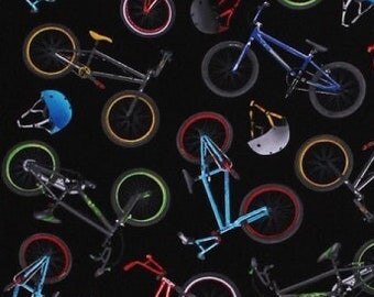 Cotton Bikes Bicycles Helmets Cycling Biking Transportation Red Blue Green Yellow Bikes on Black In Motion Fabric Print by the Yard D659.15