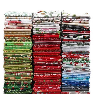 May include: A stack of fabric squares in various Christmas patterns, including red and green plaid, snowflakes, and reindeer. The fabric is arranged in a vertical stack, with each square visible.