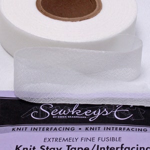 May include: White knit stay tape/interfacing, a fine fusible fabric for sewing projects. The label reads "Sewkeys by Emma Seabrooke, Knit Interfacing, Knit Interfacing, Extremely Fine Fusible, Knit Stay Tape/Interfacing, White."