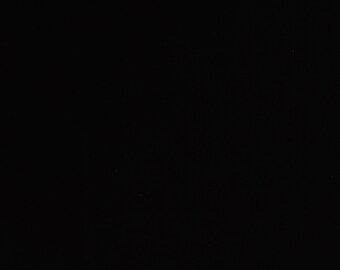 May include: A black background with a few small white dots.