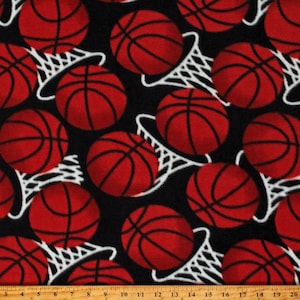 May include: Black fabric with a repeating pattern of red basketballs and white basketball hoops.