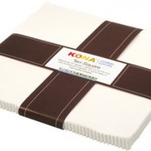 May include: A pack of 10 Kona Cotton Solids fabric squares in white. Each square measures 5 inches by 5 inches.