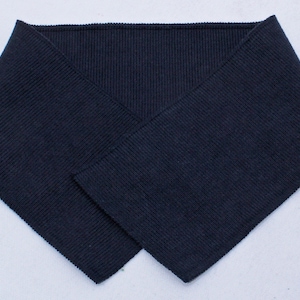 May include: A dark blue ribbed knit collar, folded in half, ready to be sewn onto a garment.