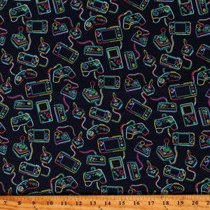 May include: A black fabric with a repeating pattern of neon green, yellow, and blue video game controllers and handheld game consoles. The pattern is on a black background.