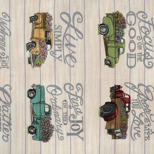 May include: Fabric panel featuring vintage trucks filled with flowers in various colors, with inspirational phrases like "Live Simply" and "Cultivate Kindness" on a light wood-grain background.
