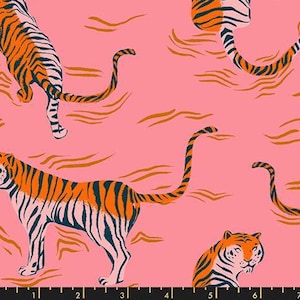 May include: Pink fabric featuring a repeating pattern of orange and navy blue tigers. The tigers are depicted in different poses, with their stripes and tails visible. The background includes orange wavy lines.