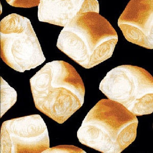 May include: A black background with a repeating pattern of white and brown bread rolls.