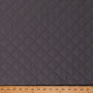 May include: A close-up of a dark gray quilted fabric with a diamond pattern. The fabric is measured in inches.