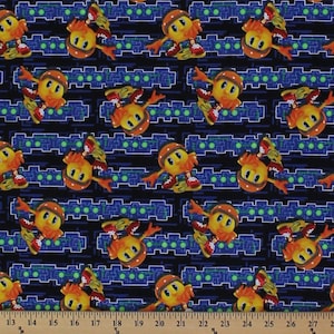 May include: A blue and black fabric with a repeating pattern of a yellow cartoon character wearing a helmet and roller skates. The character is on a blue and green circuit board background.
