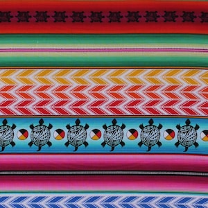 May include: Colorful fabric with a repeating pattern of red, orange, yellow, green, blue, and pink stripes. The pattern includes black turtle silhouettes and a row of turtles with a circle design in the center. A ruler is visible at the bottom of the image.
