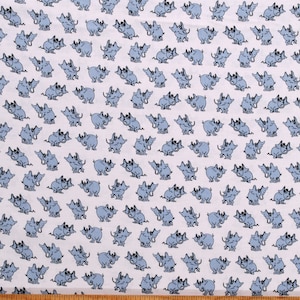 May include: A white fabric with a repeating pattern of blue elephants with wings. The elephants are facing each other and have their trunks raised.
