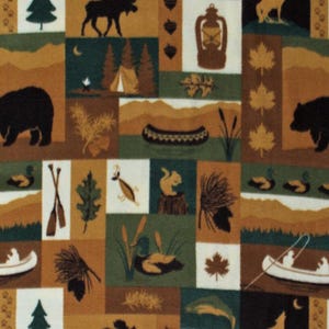 May include: A patchwork fabric featuring outdoor and wildlife scenes. The design includes squares with images of a bear, moose, pine trees, a canoe, a lantern, and a howling wolf. The color palette is composed of green, brown, and cream.