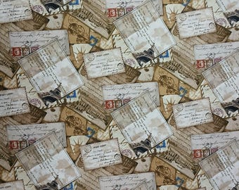 May include: Fabric with a vintage postcard design. The pattern features layered postcards with stamps, handwritten script, and illustrations of the Eiffel Tower and the Statue of Liberty. The color palette includes beige, brown, and touches of red and blue.
