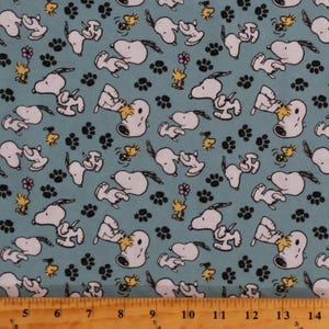 Cotton Snoopy Woodstock Peanuts Comics Characters Playing Paws on Blue Kids Cotton Fabric Print by the Yard D469.21 by Springs Creative