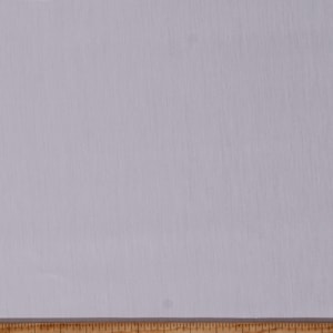 May include: A close-up of a white fabric with a subtle texture. The fabric is measured with a ruler, showing a length of 20 inches.