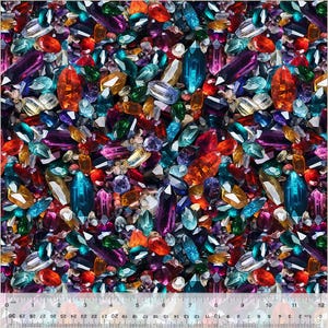 May include: A close-up image of a variety of colorful gemstones, including red, blue, green, purple, and orange. The gemstones are arranged in a random pattern and appear to be scattered on a dark surface.
