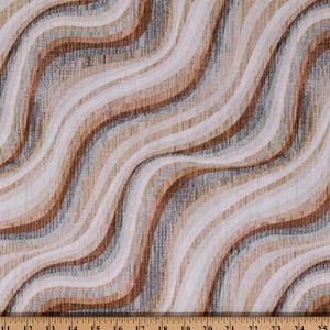 May include: Fabric with a wavy pattern in shades of brown, beige, and gray. The design features vertical stripes that curve across the material. A ruler is at the bottom, showing inch measurements.
