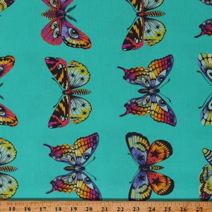 May include: A turquoise fabric with a repeating pattern of colorful butterflies. The butterflies have black, yellow, orange, red, blue, and green wings with a star pattern.