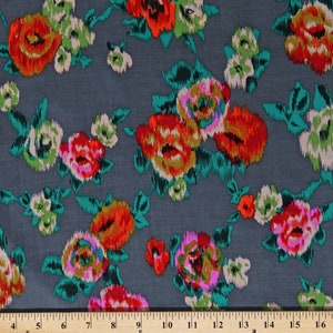 May include: Gray fabric with a floral print featuring pink, red, orange, and green flowers. The fabric has a brushed texture.