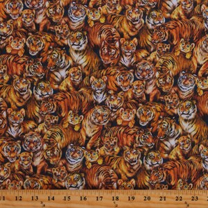 May include: A seamless fabric pattern featuring a repeating design of orange and black tigers. The tigers are of various sizes and are arranged in a random pattern. The background is a dark blue color.