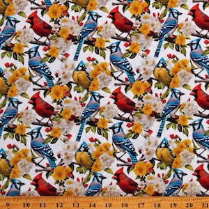 May include: A white fabric with a repeating pattern of blue jays, red cardinals, and yellow flowers. The birds are perched on branches with white blossoms.