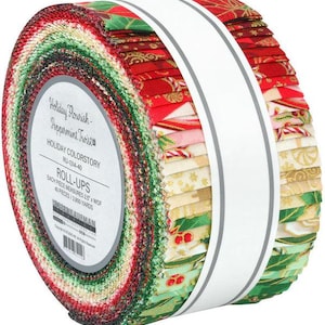 May include: A roll of fabric strips in a variety of Christmas-themed patterns and colors, including red, green, and gold. The fabric is wrapped with a white band that reads "Holiday Flourish - Peppermint Twist" and "Roll-Ups". Each piece measures 2.5 inches.