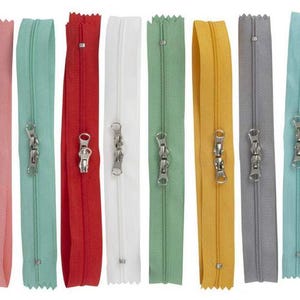 May include: Assortment of ten zipper closures in various colors, including pink, green, red, white, and yellow. Each zipper has a double slider.