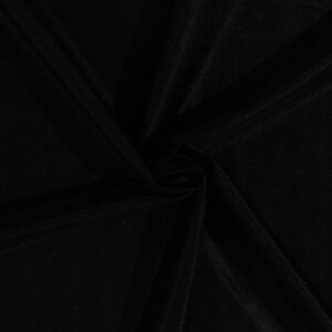 May include: Black fabric with a smooth, silky texture. The fabric is folded and draped, showing its soft and flowing nature.