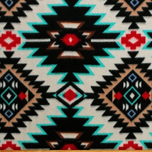 May include: A white fabric with a black, turquoise, red, and brown geometric pattern. The pattern is reminiscent of Native American designs.