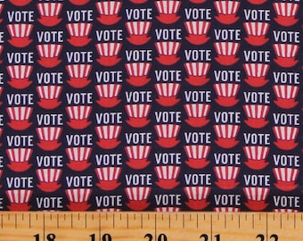May include: A navy blue fabric with a repeating pattern of red, white, and blue voting booths with the word "VOTE" printed on each booth.