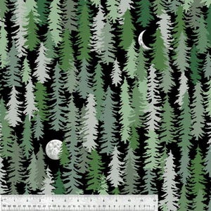 May include: Fabric with a forest design featuring various shades of green and gray trees against a black background. A crescent moon and a full moon are visible. The image includes a ruler with inch measurements.