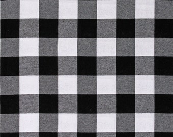 May include: Black and white checkered fabric with a white measuring tape along the bottom edge. The tape measures 18 inches.