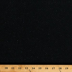 May include: Black fabric with a fine, sparkly texture. The fabric is measured with a ruler showing inches.