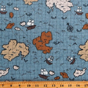 May include: A blue and brown fabric with a nautical map design. The map features islands, ships, whales, and a compass. The fabric has a grid pattern and is ideal for crafting projects.