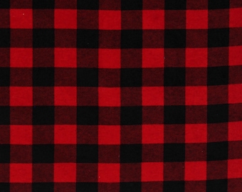 May include: Red and black buffalo plaid fabric. The fabric is shown with a ruler measuring 20 inches.