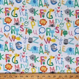 May include: White fabric with a colorful alphabet pattern. The letters are in a variety of fonts and colors, and are surrounded by small animal illustrations. The fabric is perfect for crafting projects, such as quilts, pillows, and tote bags.