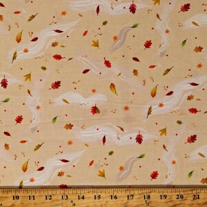 May include: Beige fabric with a white and brown leaf pattern. The leaves are scattered randomly across the fabric and are in various shades of brown, red, and orange. There are also small white swirls throughout the fabric.