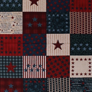 May include: A red, white, and blue fabric with a patchwork design featuring stars, stripes, and text that reads "American Spirit".