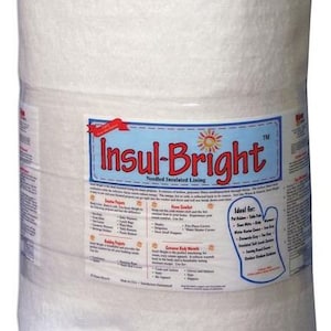 May include: A white roll of Insul-Bright Needled Insulated Lining. The label lists various uses for the product, including creative projects, home comfort, and extreme body warmth. The label also includes a list of ideal uses for the product, such as pot holders, table pads, oven mitts, and more.