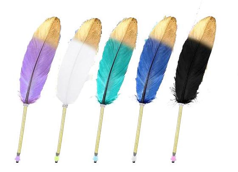May include: Five pens with gold-toned metal barrels and decorative feathers attached to the top. The feathers are colored purple, white, teal, blue, and black, each featuring a gold-dipped tip. Each pen has a small star-shaped cap at the base.