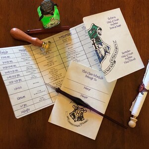 May include: A printed class schedule with a Hogwarts crest, a wax seal stamp with a wooden handle, a dark ink pen, a small green glass bottle, and a rolled parchment scroll tied with a red wax seal. The schedule lists times and subjects.