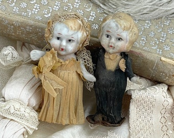 1920s Bride and groom hand painted ceramic bisque wedding cake toppers dressed in crepe paper wedding dress and black tuxedo