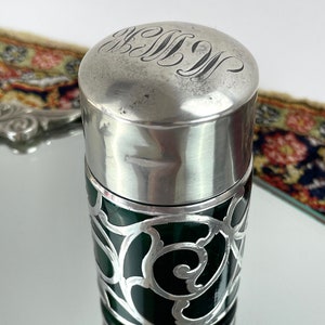 Antique sterling silver lid over emerald glass smelling salts bottle 1900’s