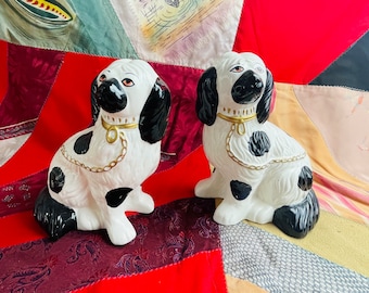 1980s Pair of &#39;Staffordshire&#39; style replica ceramic black and white King Charles spaniel dogs with gold collar and leash