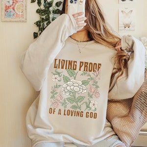 Living Proof Of A Loving God Sweatshirt Boho Christian Sweatshirt For Women Retro Floral Bible Verse Tee Faith Based Apparel Religious Gift
