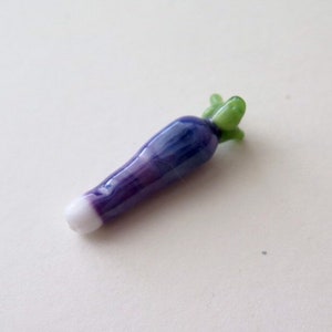 Turnip   A la carte also could be a purple radish or carrot..