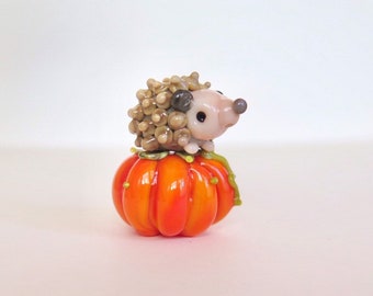 little brown nose     tiny ball of hedgehog ... lampwork bead.....